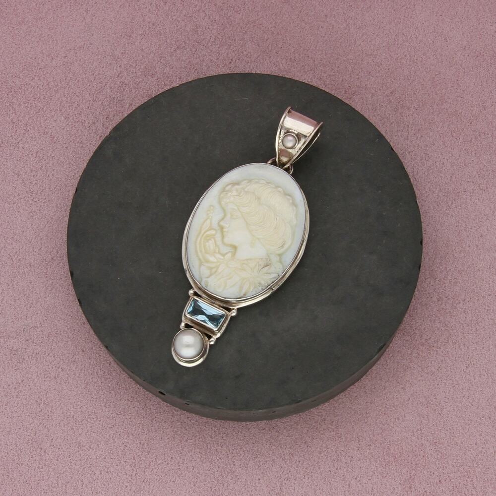 sterling silver topaz & carved mother of pearl silhouette pendant